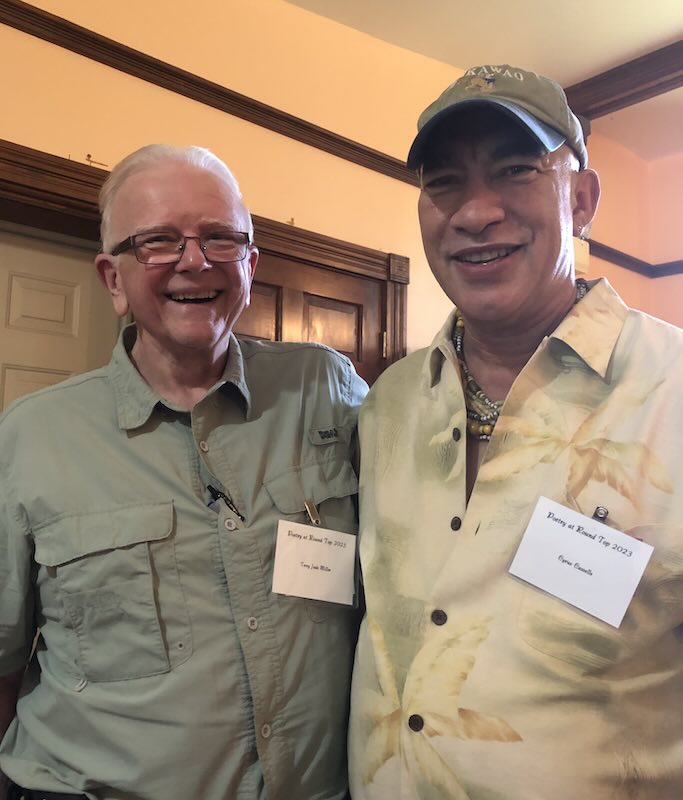 Terry poses beside Cyrus Cassells.