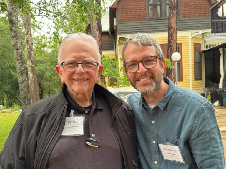 Terry poses beside James Crews.