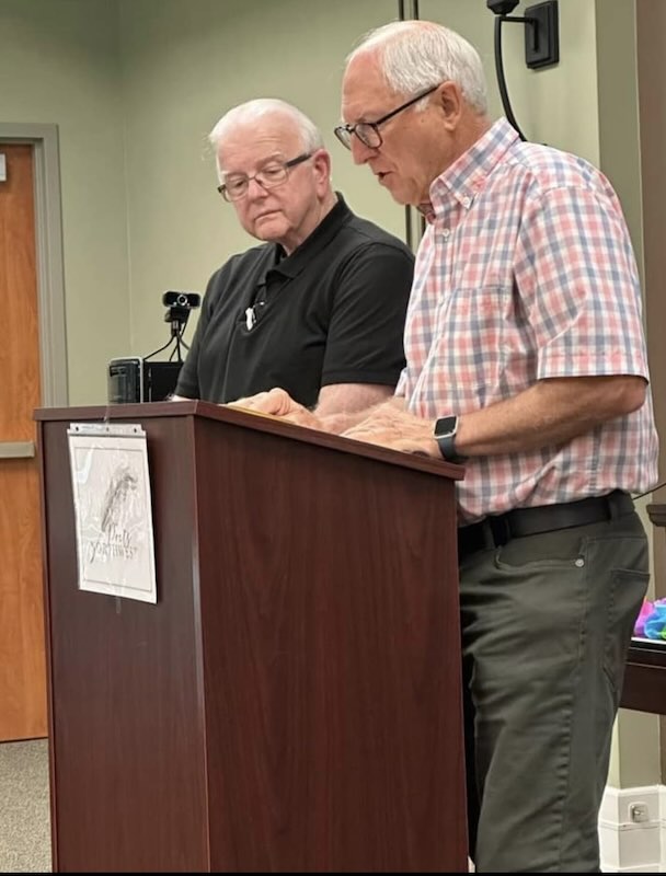 Terry poses beside Mike Owens.